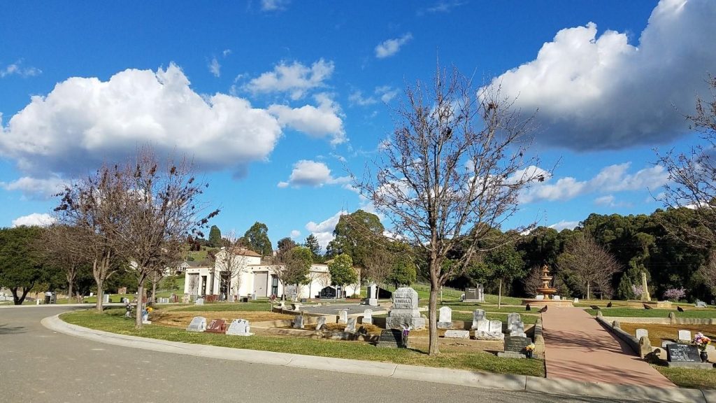 Local Resources - Burial area with trees and fountain in center